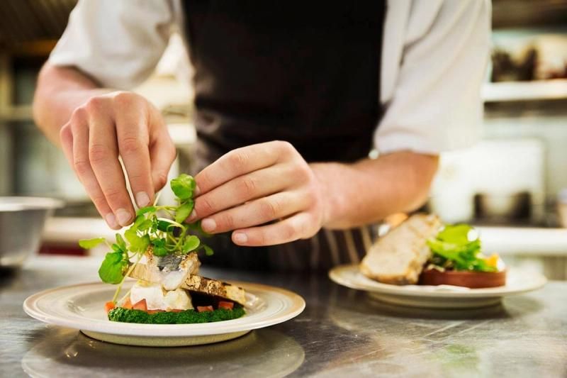 Chef plating up some food
