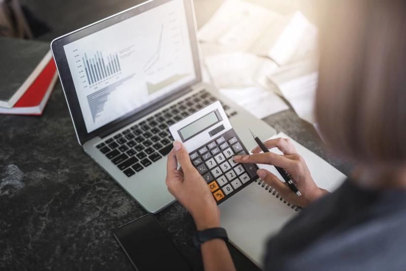 Accountant using a calculator