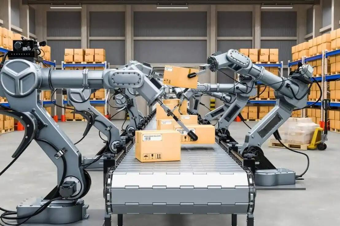 Robots navigate a warehouse filled with stacked boxes, showcasing automation in logistics and inventory management.