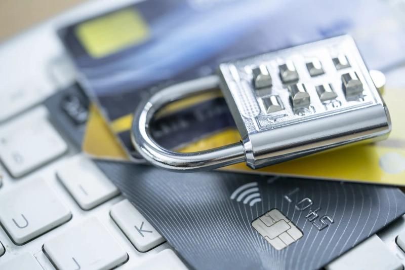 Padlock sat on top of some bank cards