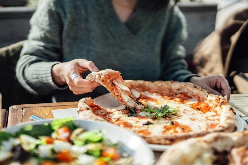 Customer enjoying a pizza