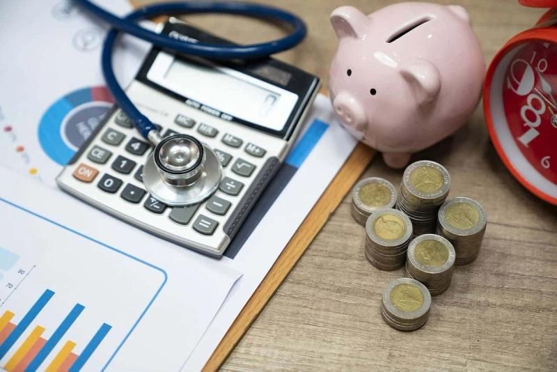 Desk displaying employee benefits like health care and cash
