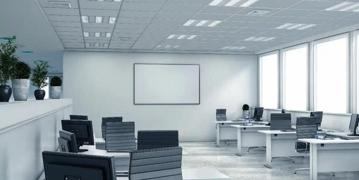 A modern office space with white walls and black chairs, creating a clean and professional atmosphere.