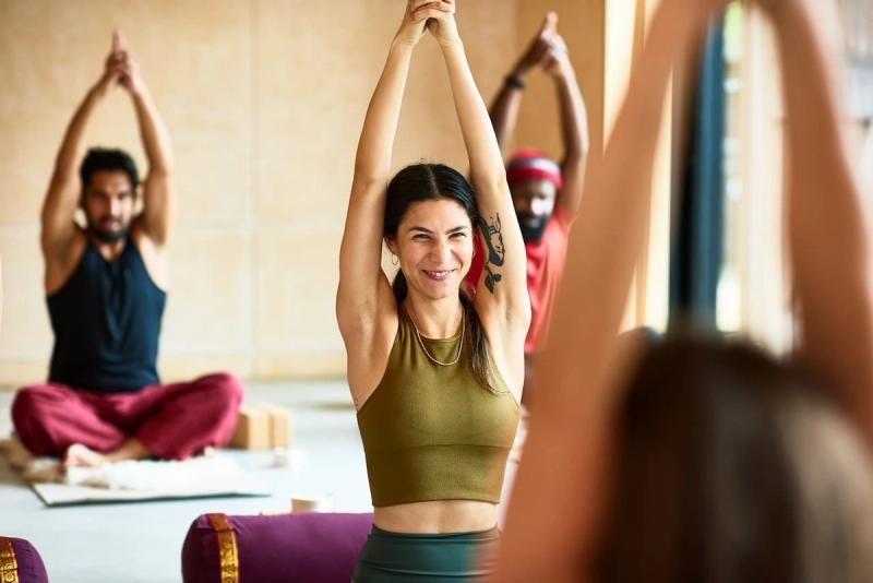 Group of people stretching in a fitness class