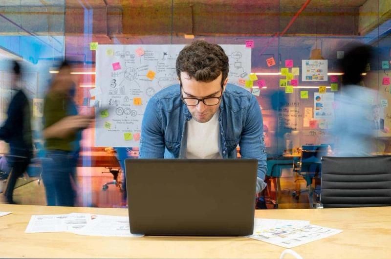 Young person working on a laptop