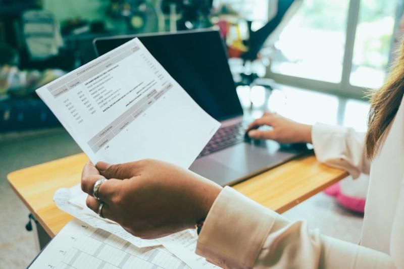 Business owner looking at an invoice