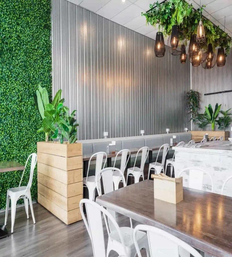 Restrautant decorated with green plants